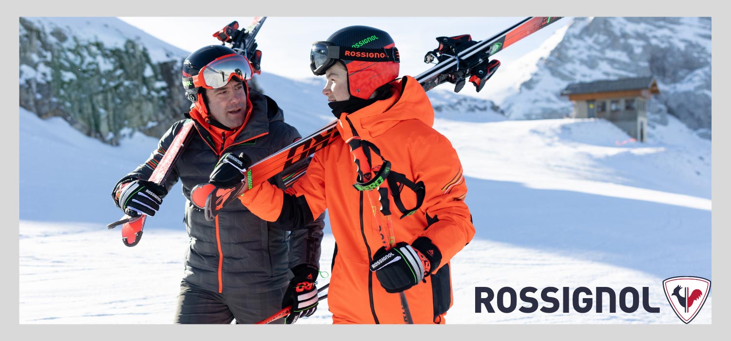 Zwei Maenner in Rossignol Skibekleidung