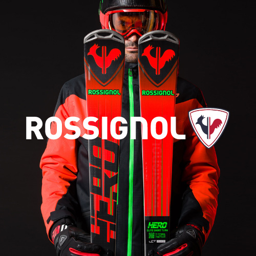 Nahaufnahme Mann in rot schwarzer Rossignol Skibekleidung mit Ski